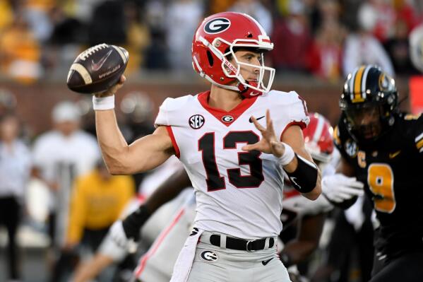 Georgia quarterback Stetson Bennett throws during the first half of an NCAA college football game against Missouri Saturday, Oct. 1, 2022, in Columbia, Mo. (AP Photo/L.G. Patterson)