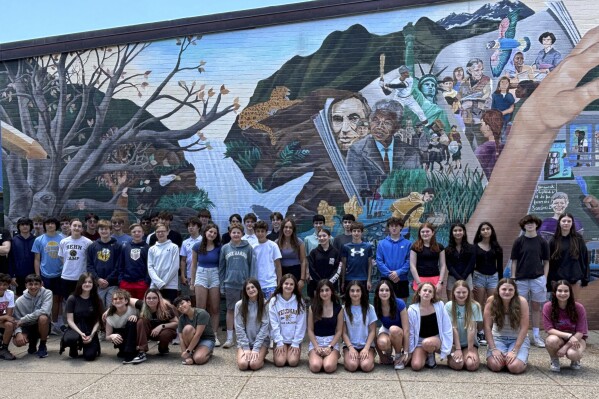 This image provided by Tamatha Bibbo, principal of the Pollard Middle School in Needham, Mass. on Wednesday, June 12, 2024 shows twenty-three sets of twins who graduated from the Pollard Middle School. They make up about 10% of the 8th grade class. (Tamatha Bibbo via AP)