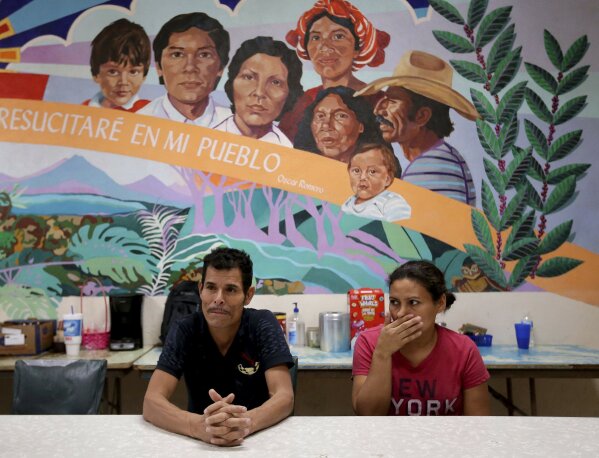 
              Melvin and Iris, both from Honduras, tell of their separation from their children at the border during a news conference at the Annunciation House, Monday, June 25, 2018, in El Paso, Texas. 32 parents waiting to be reconciled with their children have been released by Border Patrol the the Annunciation House. (AP Photo/Matt York)
            