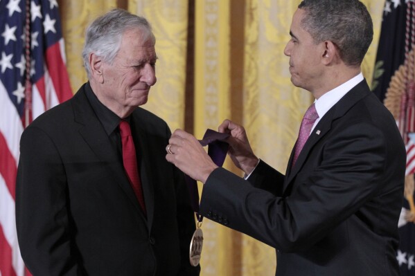 FILE - President Barack Obama presents a 2010 National Medal of Arts to New Republic theatre critic Robert Brustein, March 2, 2011, during a ceremony in the East Room of the White House in Washington. Brustein, a giant in the theatrical world as critic, playwright, crusader for artistic integrity and founder of two of the leading regional theaters in the country, died on Sunday, Oct. 29, 2023. He was 96. (AP Photo/Pablo Martinez Monsivais, File)