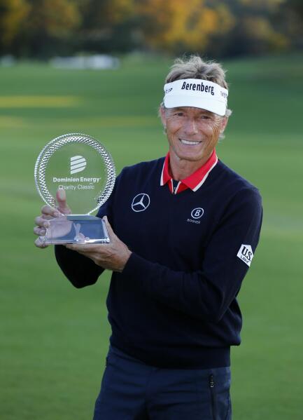 Bernhard Langer holds his trophy after winning the Dominion Energy Charity Classic golf tournament at Country Club of Virginia on Sunday, Oct. 24, 2021, in Richmond, Va. (Daniel Sangjib Min/Richmond Times-Dispatch via AP