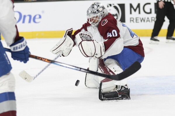 Colorado Avalanche goaltender Alexandar Georgiev (40) makes a save against the Vegas Golden Knights during the second period of an NHL hockey game Sunday, April 14, 2024, in Las Vegas. (AP Photo/Ian Maule)