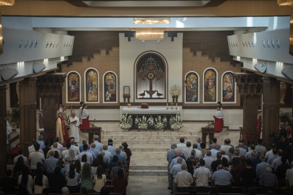 Chaldean Christians attend a service in the Mar Youssef Cathedral in Irbil, Iraq, on Sunday, July 30, 2023. Today, the number of Christians in Iraq is 150,000, compared to 1.5 million in 2003. (AP Photo/Julia Zimmermann/Metrography)