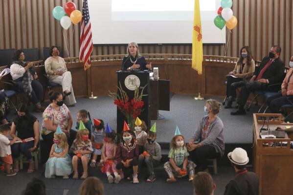 FILE - Gov. Michelle Lujan Grisham announces an increase in child care subsidies on Thursday, July 1, 2021, in Santa Fe, N.M. New Mexico is further increasing its child care subsidies. They're already the most generous and broadly available in the US. Democratic Gov. Michelle Lujan Grisham says the state will start waiving child care copays to middle-income families starting May 1, 2022. (AP Photo/Cedar Attanasio, File)