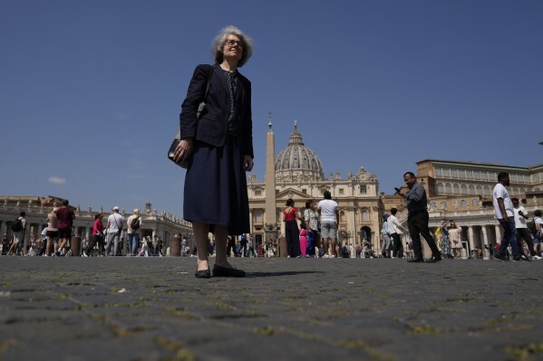 Sister Nathalie Becquart, the first female undersecretary in the Vatican's Synod of Bishops, poses for a photo in front of St. Peter's Square, Monday, May 29, 2023. Becquart is charting the global church through an unprecedented, and even stormy, period of reform as one of the highest-ranking women at the Vatican. (AP Photo/Alessandra Tarantino)