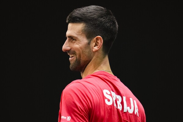 Serbia's Novak Djokovic reacts as he practices during a training session of the Davis Cup in Malaga, Spain, Tuesday, Nov. 21, 2023. (AP Photo/Manu Fernandez)