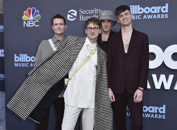 FILE - Drew MacFarlane, from left, Dave Bayley, Joe Seaward and Edmund Irwin-Singer of Glass Animals arrive at the Billboard Music Awards on Sunday, May 15, 2022, at the MGM Grand Garden Arena in Las Vegas. The English indie-pop band releases its fourth album on July 19. (Photo by Jordan Strauss/Invision/AP, File)