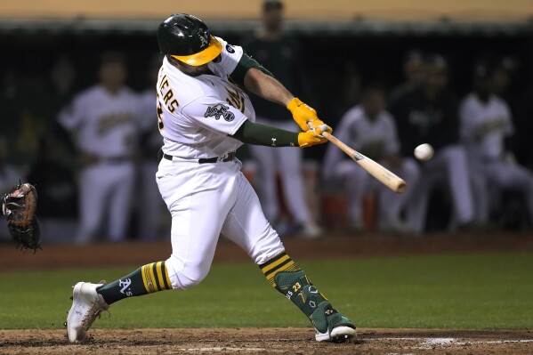 Oakland Athletics' Shea Langeliers hits a three-run home run against the Detroit Tigers during the sixth inning of a baseball game in Oakland, Calif., Friday, Sept. 22, 2023. (AP Photo/Jeff Chiu)