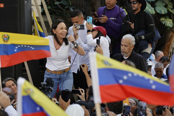 FILE - Opposition coalition presidential hopeful Maria Corina Machado speaks to supporters at a campaign event in Caracas, Venezuela, Jan. 23, 2024. As a March 25, 2024 deadline nears to register to compete in the presidential election, Machado faces pressure from foreign leaders and fellow government opponents to abandon her dead-end candidacy, because she’s technically barred from office. (AP Photo/Jesus Vargas, File)