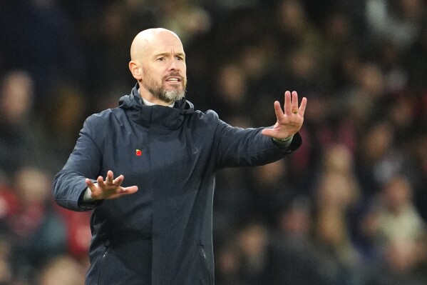 Manchester United's head coach Erik ten Hag reacts during the English Premier League soccer match between Manchester United and Luton Town at the Old Trafford stadium in Manchester, England, Saturday, Nov. 11, 2023. (AP Photo/Jon Super)