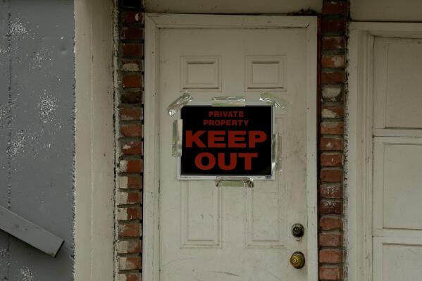 FILE - A keep out sign is posted on a home, Wednesday, April 19, 2023, near the house where 84-year-old Andrew Lester shot 16-year-old Ralph Yarl a week earlier in Kansas City, Mo. (AP Photo/Charlie Riedel, File)