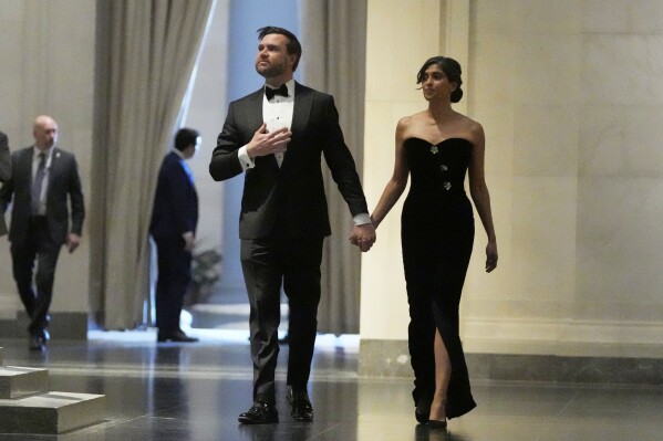 Vice President-elect JD Vance, left, and his wife, Usha Vance, arrive to a dinner event at the National Gallery of Art in Washington, Saturday, Jan. 18, 2025. (AP Photo/Mark Schiefelbein)