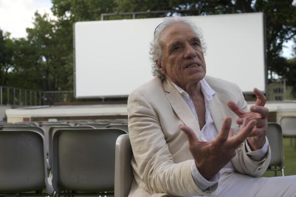 Director Abel Ferrara gestures during an interview with the Associated Press on his latest movie "Padre Pio" in Rome, Tuesday, Aug. 23, 2022. Abel Ferrara, whose gritty New York exploitation films of the 1980s and 1990s delved into the soulless evils of drug addiction, corruption and sexual violence, pays homage to one of Italy’s best-known and most revered saints in his newest film, “Padre Pio.” (AP Photo/Gregorio Borgia)