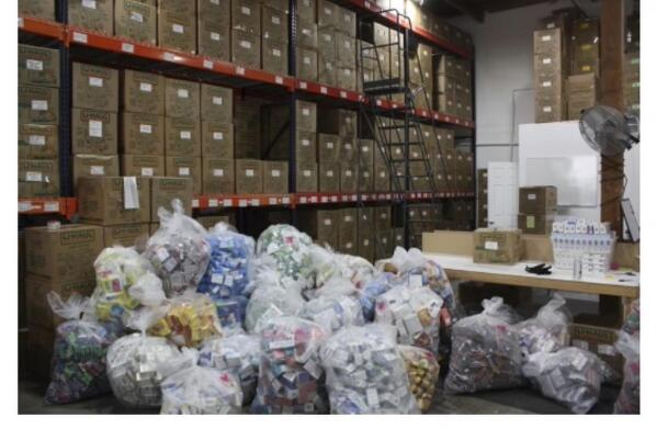 This undated image released by the California Attorney General's Office shows stolen items from Bay Area retailers, recovered in a warehouse in Concord, Calif., where a search warrant was executed by California law enforcement authorities in the San Francisco Bay Area. Spurred by a recent run of large-scale smash-and-grab robberies, prosecutors and retailers are pushing back on assertions by California's governor and attorney general that they have enough tools to combat retail theft in the wake of a voter-approved easing of related laws. (California Attorney General's Office via AP)