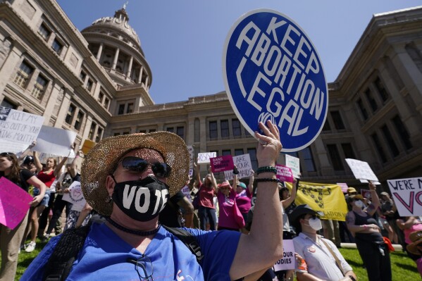 FILE - Abortion rights protesters participate in a rally at the Texas State Capitol in Austin, Texas, on May 14, 2022.  A pregnant Texas woman whose fetus has a lethal diagnosis asked a court on Tuesday, December 5, 2023, to allow her to terminate her pregnancy.  , bringing what his lawyers say is the first lawsuit of its kind in the US since Roe v. Wade was overturned last year.  (AP Photo/Eric Gay, File)