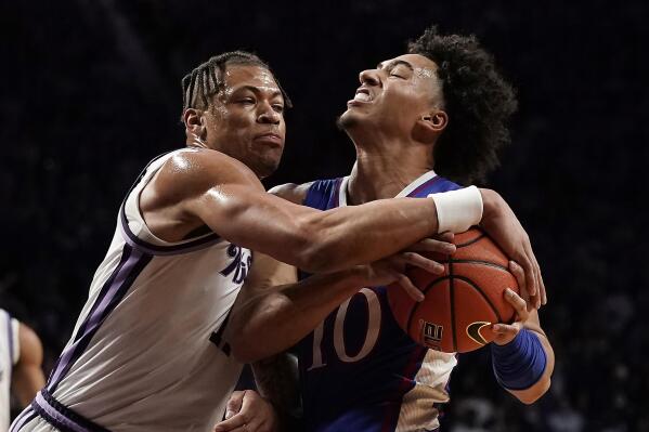 Kansas State forward Keyontae Johnson, left, tries to steal the ball from Kansas forward Jalen Wilson (10) during the first half of an NCAA college basketball game Tuesday, Jan. 17, 2023, in Manhattan, Kan. (AP Photo/Charlie Riedel)