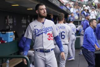 Cody Bellinger of the Los Angeles Dodgers stands on the field