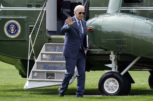 President Joe Biden waves as he arrives on the South Lawn of the White House, Monday, Aug. 14, 2023, in Washington. (AP Photo/Evan Vucci)