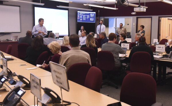 
              Governor Roy Cooper talks to emergency personnel local officials and members of the media about the ongoing Hurricane Florence preparation efforts in the Emergency Operations Center at the New Hanover County Administration Building In Wilmington, N.C. Sept. 10, 2018. Hurricane Florence now a category 3 hurricane is expected to make land fall somewhere along the North Carolina coastline towards the end of the week. (Ken Blevins /The Star-News via AP)
            
