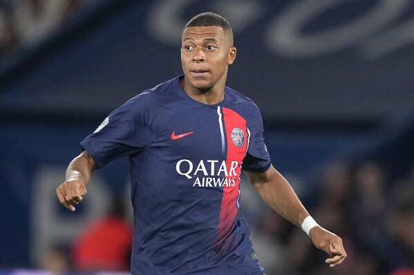 FILE - PSG's Kylian Mbappe looks on during the French League One soccer match between Paris Saint-Germain and Lens at the Parc des Princes stadium in Paris, Saturday, Aug. 26, 2023. Mbappe has told Paris Saint-Germain he will leave the club at the end of the season, it was reported on Thursday, Feb. 15, 2024. (AP Photo/Michel Euler, File)