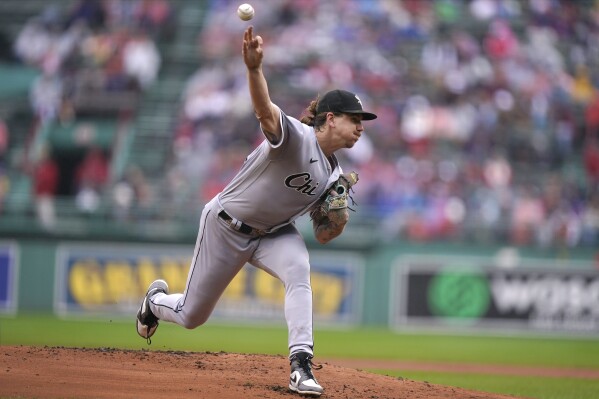 Chicago White Sox's Mike Clevinger delivers a pitch to a Boston Red Sox batter in the first inning of a baseball game, Sunday, Sept. 24, 2023, in Boston. (AP Photo/Steven Senne)