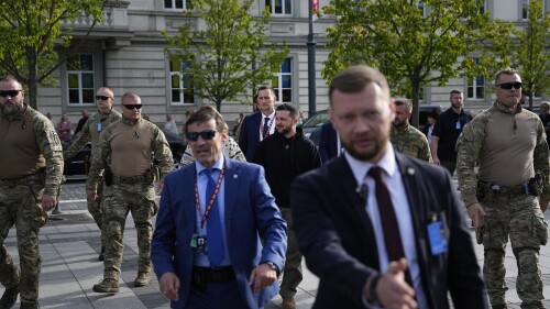 Ukraine's President Volodymyr Zelenskyy, center, arrives for an event on the sidelines of a NATO summit in Vilnius, Lithuania, Tuesday, July 11, 2023. Ukrainian President Volodymyr Zelenskyy on Tuesday blasted as "absurd" the absence of a timetable for his country's membership in NATO, injecting harsh criticism into a gathering of the alliance's leaders that was intended to showcase solidarity in the face of Russian aggression. (AP Photo/Pavel Golovkin)