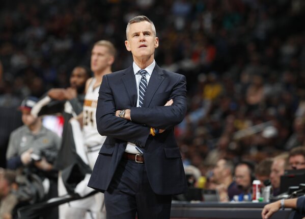 FILE - In this Saturday, Dec. 14, 2019, file photo, Oklahoma City Thunder head coach Billy Donovan checks the scoreboard in the first half of an NBA basketball game against the Denver Nuggets in De...