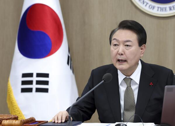 South Korean President Yoon Suk Yeol speaks during a cabinet council meeting at the presidential office in Seoul, South Korea, Tuesday, Dec. 27, 2022. South Korea’s president on Tuesday called for a stronger air defense and high-tech stealth drones to better monitor North Korea, a day after it accused five North Korea of flying drones across the rivals’ tense border for the first time in five years. (Im Hun-jung/Yonhap via AP)
