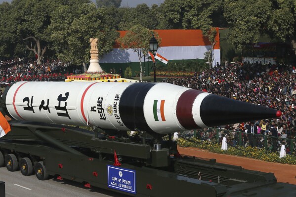 FILE - In this Jan. 26, 2013, file photo, the long range ballistic Agni-V missile is displayed during Republic Day parade, in New Delhi, India. India has successfully conducted its first test flight of a domestically developed missile that can carry multiple warheads, Prime Minister Narendra Modi said Monday. (AP Photo/Manish Swarup, File)