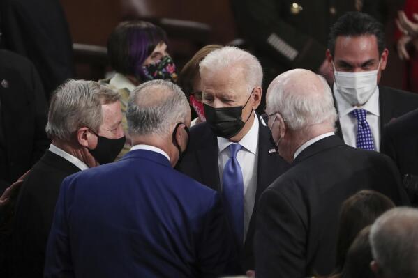 President Joe Biden speaks to Sen. Dick Durbin, D-Ill.,, left, Senate Majority Leader Chuck Schumer of N.Y., center, and Sen. Patrick Leahy, D-Vt., after speaking to a joint session of Congress Wednesday, April 28, 2021, in the House Chamber at the U.S. Capitol in Washington. (Michael Reynolds/Pool via AP)