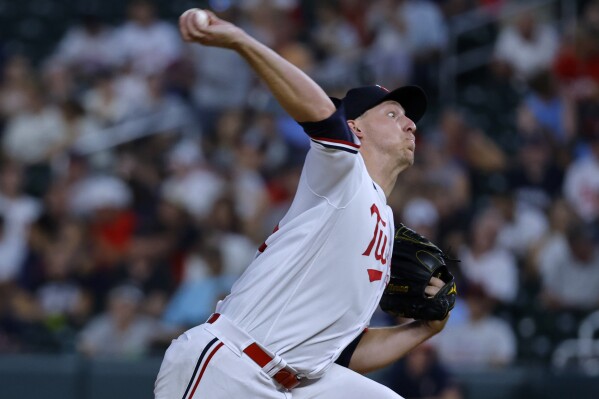 Texas Rangers relief pitcher Dane Dunning prepares to pitch during