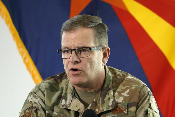 FILE - In this May 20, 2020, file photo, then-Arizona National Guard Maj. Gen. Michael McGuire, director of the Department of Emergency and Military Affairs, answers a question at a news conference in Phoenix. McGuire, the former head of the Arizona National Guard, has filed papers to run for the U.S. Senate, joining what's likely to be a crowded field of candidates seeking the Republican nomination. (AP Photo/Ross D. Franklin, Pool, File)