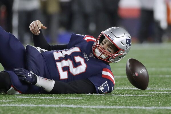 New England Patriots quarterback Tom Brady lands on the turf after being sacked by Kansas City Chiefs defensive end Chris Jones in the second half of an NFL football game, Sunday, Dec. 8, 2019, in Foxborough, Mass. (AP Photo/Elise Amendola)