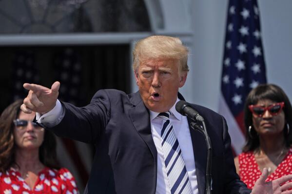 Former President Donald Trump imitates the shooting of a gun with his finger while talking about gun violence in Chicago as he speaks at Trump National Golf Club in Bedminster, N.J., Wednesday, July 7, 2021. (AP Photo/Seth Wenig)