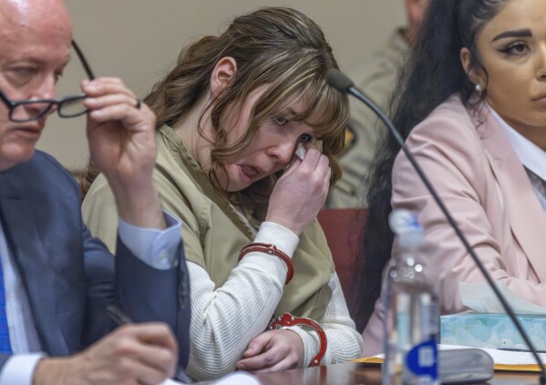 Hannah Gutierrez-Reed wipes her tears at her sentencing hearing in state district court in Santa Fe, New Mexico, on Monday, April 15, 2024. Gutierrez-Reed, the armorer on the set of the Western film "Rust," was sentenced to 18 months in prison for involuntary manslaughter in the death of cinematographer Halyna Hutchins, who was fatally shot by Alec Baldwin in 2021. (Luis Sánchez Saturno/Santa Fe New Mexican via AP, Pool)