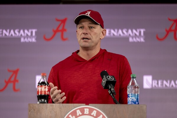 Alabama head coach Kalen DeBoer talks with the media after the team's first NCAA college spring football practice Monday, March 4, 2024, in Tuscaloosa, Ala. (AP Photo/Vasha Hunt)