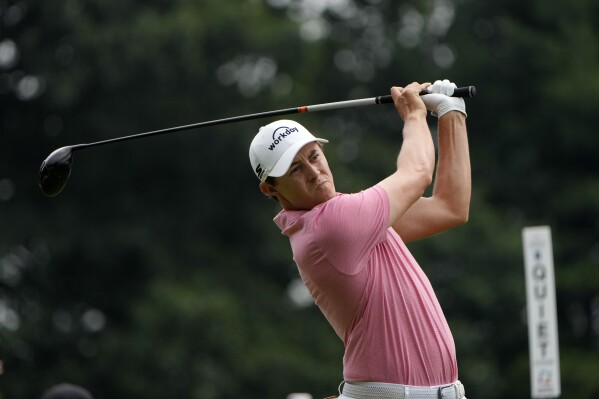 Matt Fitzpatrick, of England, tees off on the first hole during the final round of the Travelers Championship golf tournament at TPC River Highlands, Sunday, June 23, 2024, in Cromwell, Conn. (AP Photo/Seth Wenig)