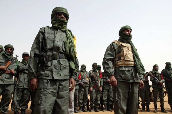 FILE - Malian troops join with former members of the Tuareg rebellion for a joint patrol in Gao, Mali, Feb. 23, 2017. Mali's military government has announced Wednesday, Nov. 29, 2023 an investigation into ethnic rebel leaders who signed a peace agreement in 2015 to halt their quest for an independent state, a development experts say shows the crucial deal has collapsed.(AP Photo/Baba Ahmed, File)