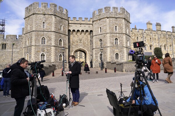 Media waits outside Windsor Castle in Windsor, England, Saturday, March 23, 2024. Britain's Kate, Princess of Wales's revelation she is undergoing treatment for cancer has sparked an outpouring of support and well wishes from around the world. (AP Photo/Alberto Pezzali)