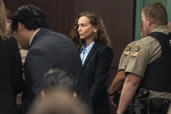 Kaitlin Armstrong enters the courtroom during the first day of her trial at the Blackwell-Thurman Criminal Justice Center, Wednesday, Nov. 1, 2023, in Austin, Texas.. Armstrong is charged with murder in connection with the shooting death of pro cyclist Anna Moriah Wilson. (Mikala Compton/Austin American-Statesman via AP, Pool)