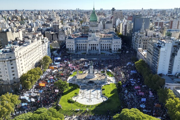 Students march to Congress demanding more funding for public universities and protesting against austerity measures proposed by President Javier Milei in Buenos Aires, Argentina, Tuesday, April 23, 2024. (AP Photo/Rodrigo Abd)