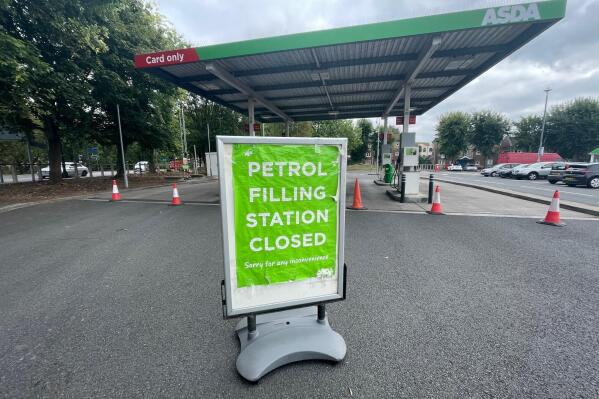 A closed petrol station in Bristol, England, Saturday Sept. 25, 2021. The haulage industry says the U.K. is short tens of thousands of truckers, due to a perfect storm of factors including the coronavirus pandemic, an aging workforce and an exodus of European Union workers following Britain’s departure from the bloc. BP and Esso shut a handful of their gas stations this week, and motorists have formed long lines as they try to fill up in case of further disruption. (Ben Birchall/PA via AP)