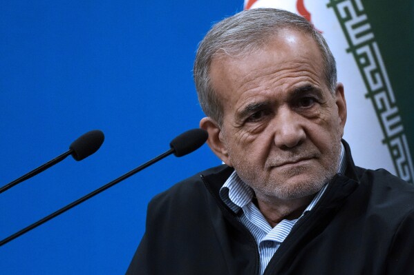 Iranian President Masoud Pezeshkian listens to a question during a press conference in Tehran, Iran, Monday, Sept. 16, 2024. (AP Photo/Vahid Salemi)