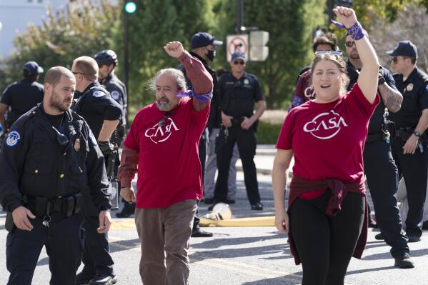 Demonstrators are arrested by U.S. Capitol Police as they protest in support of the Deferred Action for Childhood Arrivals (DACA), during a demonstration on Capitol Hill in Washington, Thursday, Oct. 6, 2022. ( AP Photo/Jose Luis Magana)