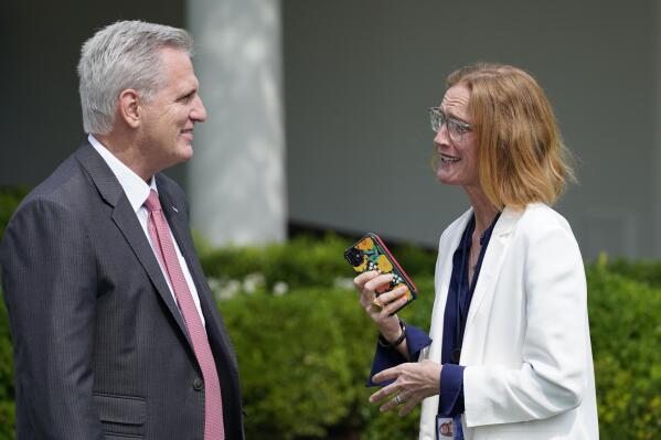 FILE - House Speaker Kevin McCarthy of Calif., left, talks with White House director of legislative affairs Louisa Terrell, right, before the start of an event in the Rose Garden of the White House in Washington, July 26, 2021. President Joe Biden and McCarthy are turning to a select group of negotiators to help broker a deal to increase the nation’s borrowing authority. (AP Photo/Susan Walsh, File)