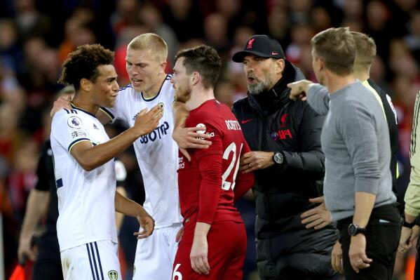 Tempers flare between Liverpool's Andrew Robertson and Leeds United's Tyler Adams, left, during the Premier League match between Liverpool and Leeds United at Anfield, Liverpool, Saturday Oct. 29, 2022. (Richard Sellers/PA via AP)
