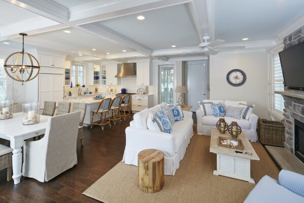This photo shows a room design by designer and builder Marnie Oursler. To brighten a room during the winter months, Oursler suggested adding light-colored slip covers to sofas or dining room chairs, as seen in this open-plan home built by Oursler's company in Bethany Beach, Del. (Photo by Dana Hoff/Marnie Oursler)