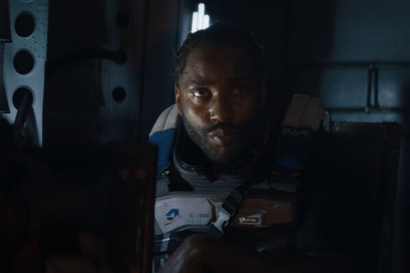 This image released by 20th Century Studios shows John David Washington in a scene from "The Creator." (20th Century Studios via AP)