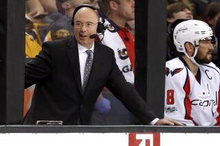 FILE - Pierre McGuire broadcasts during the third period of an NHL hockey game between the Boston Bruins and the Washington Capitals in Boston, in this Saturday, April 8, 2017, file photo. Longtime television analyst Pierre McGuire is returning to an NHL front office as senior vice president of player development for the Ottawa Senators. The club announced McGuire's appointment Monday morning, July 12, 2021. (AP Photo/Winslow Townson, File)