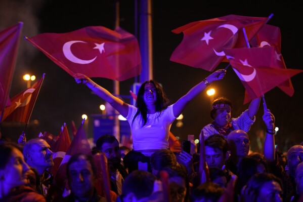 Republican People's Party, or CHP, supporters gather to celebrate outside City Hall in Istanbul, Turkey, Sunday, March 31, 2024. Turkey's main opposition party retained its control over key cities and made huge gains elsewhere in Sunday's local elections, preliminary results showed, in a major upset to President Recep Tayyip Erdogan, who had set his sights on retaking control of those urban areas. (AP Photo/Khalil Hamra)